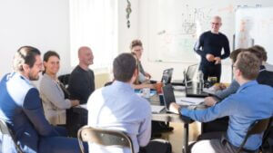 people siting at a table making business