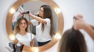 woman having her hair cut